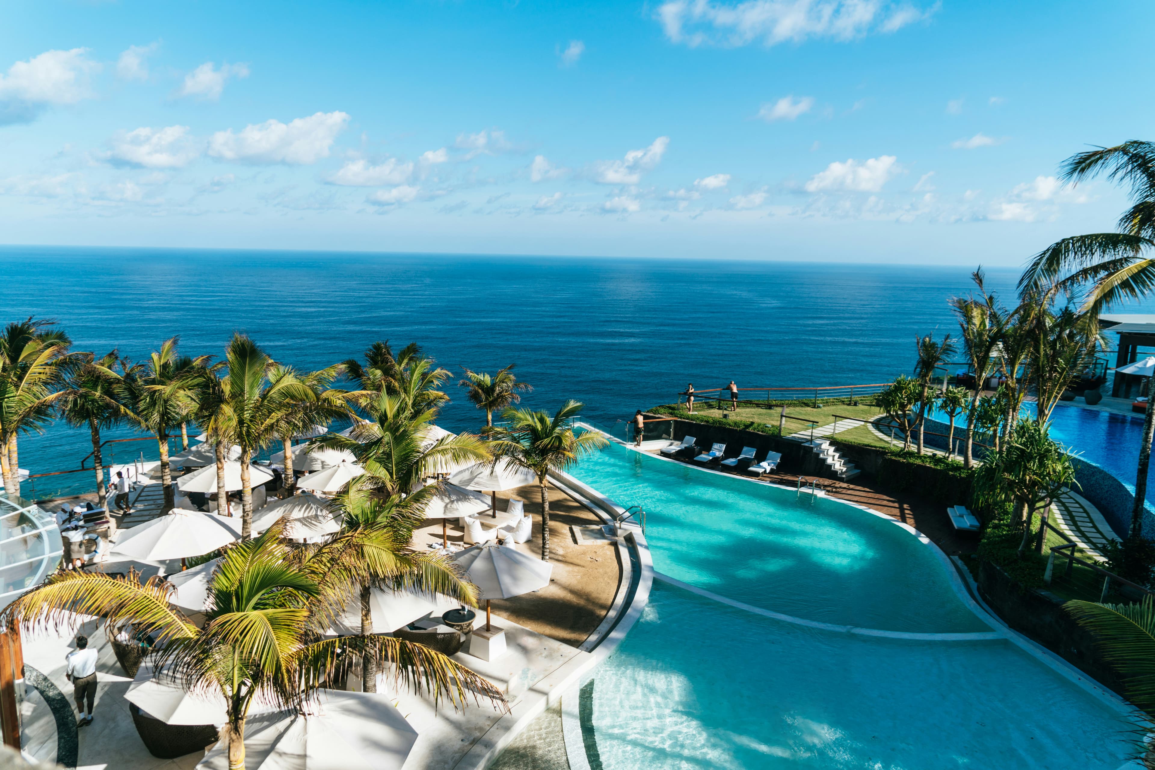 Infinity swimming pool overlooking the sea at dusk